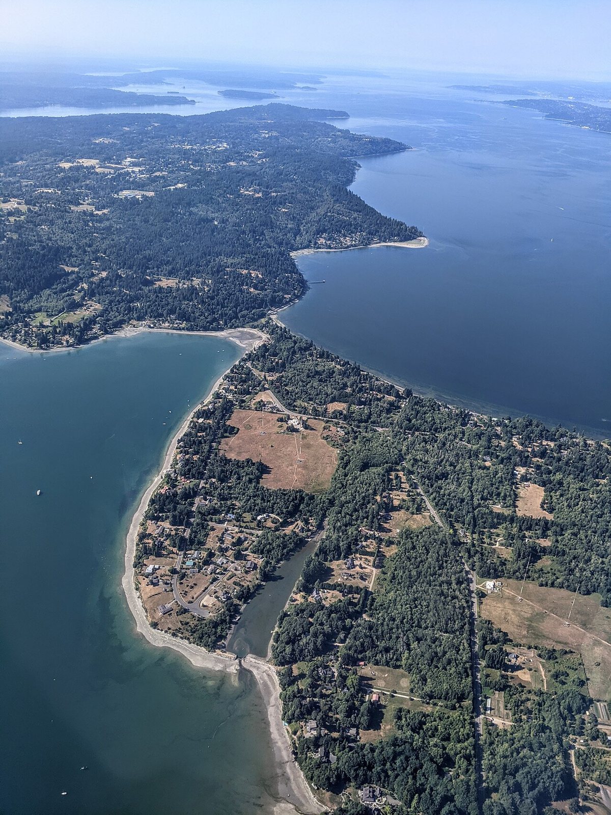 Vashon Island farm stand and rural road with Puget Sound in the distance