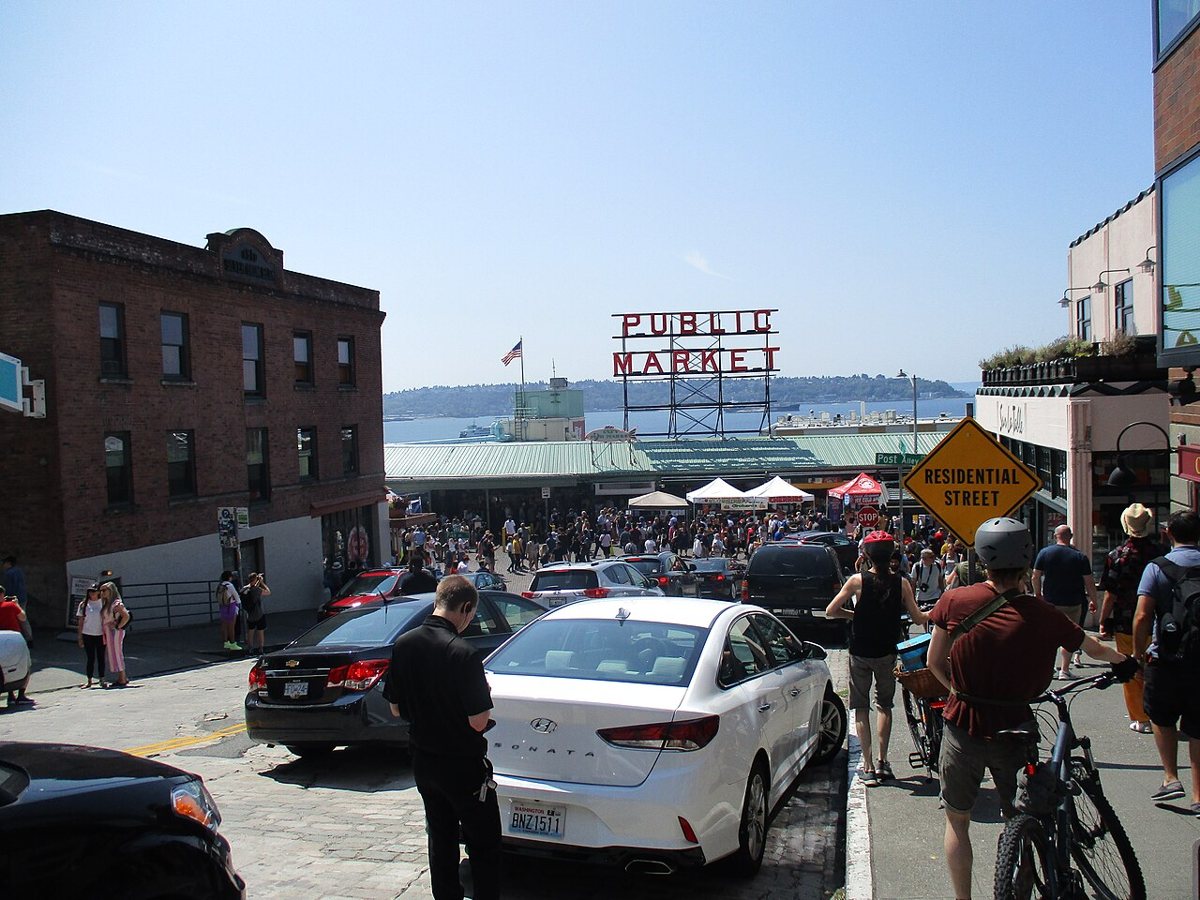 The iconic Public Market sign and crowds at Pike Place Market in Seattle